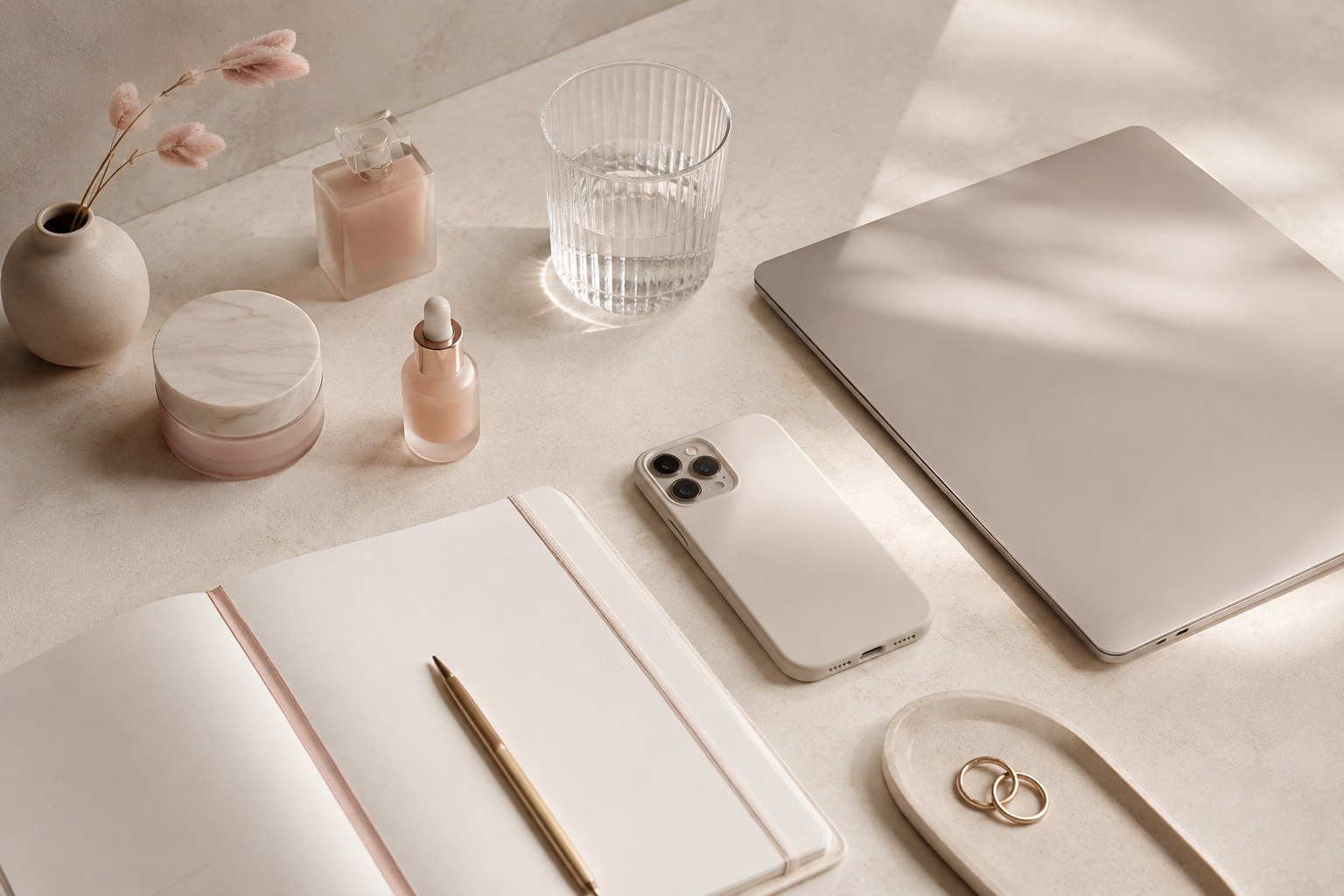 Blush beauty business flatlay with notebook and laptop